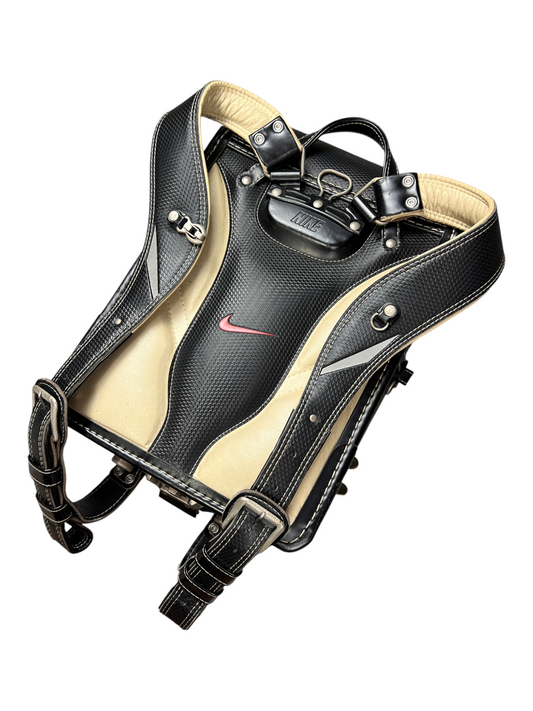 Nike Randoseru black and cream, red Swoosh - harness at an angle, adjustable buckles