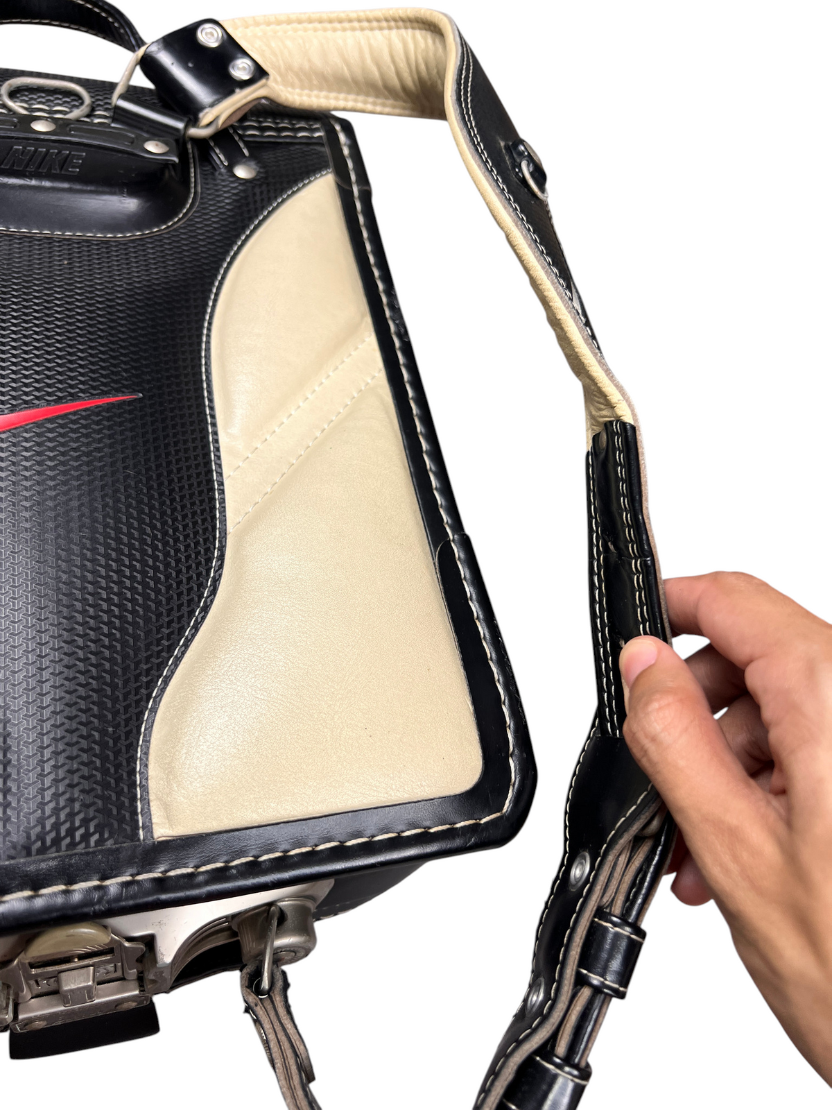 Nike Randoseru black and cream, red Swoosh - grab handle held by hand