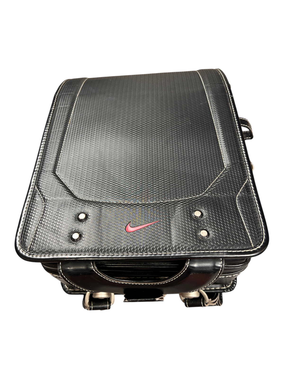 Nike Randoseru black and cream, red Swoosh - front flap from a low angle with side hooks