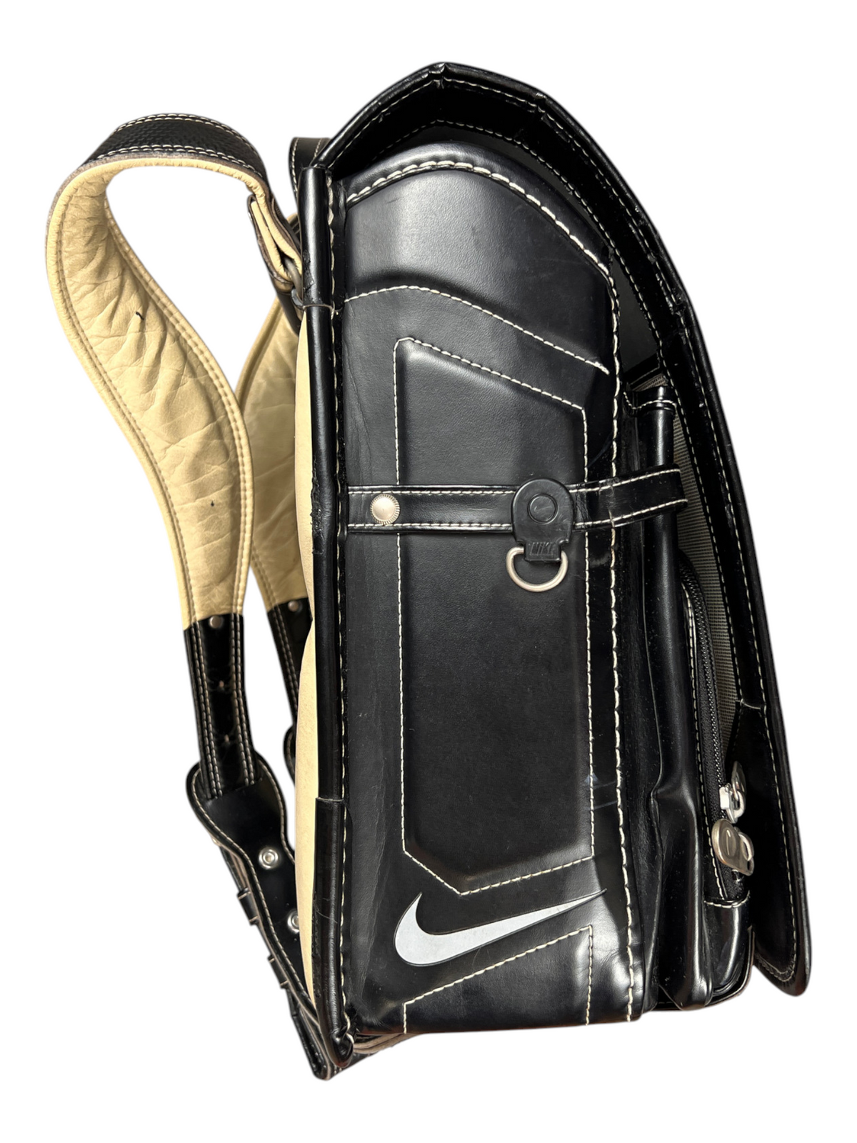 Nike Randoseru black and cream, red Swoosh - side profile with the flap closed