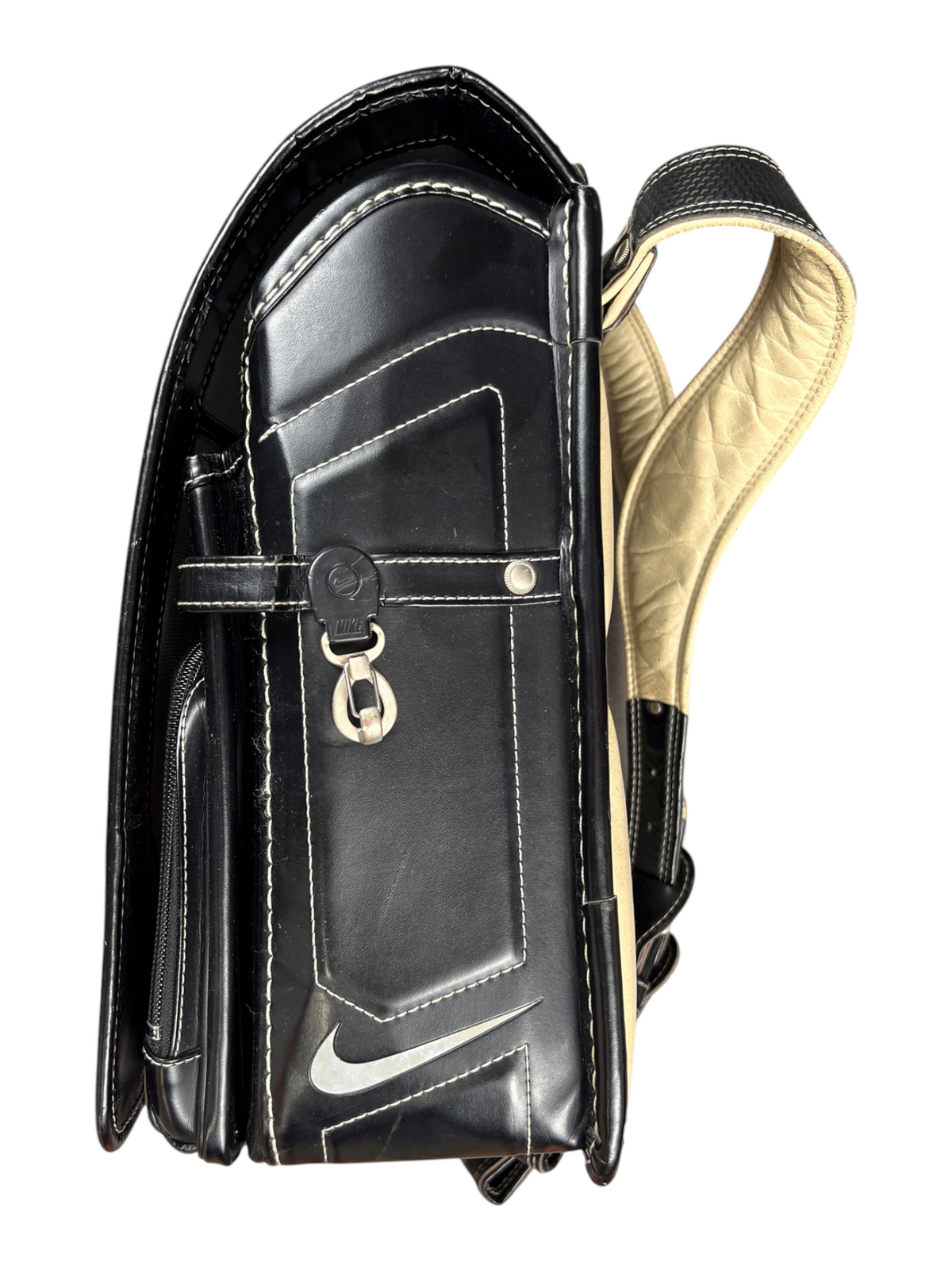 Nike Randoseru black and cream, red Swoosh - top view of the closed flap