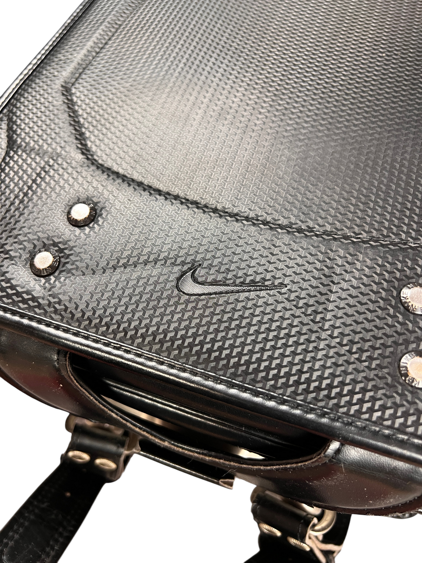 Nike Randoseru blackout - tonal Swoosh on the textured panel with rivets