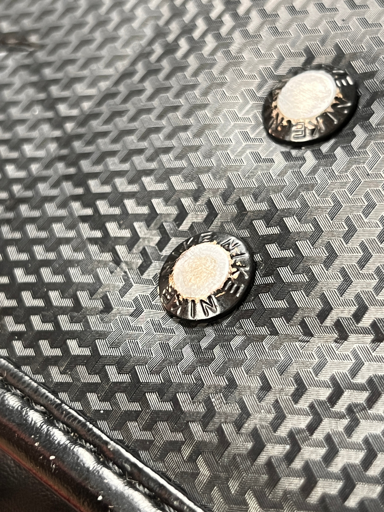 Nike Randoseru blackout - two metal studs on the patterned leather