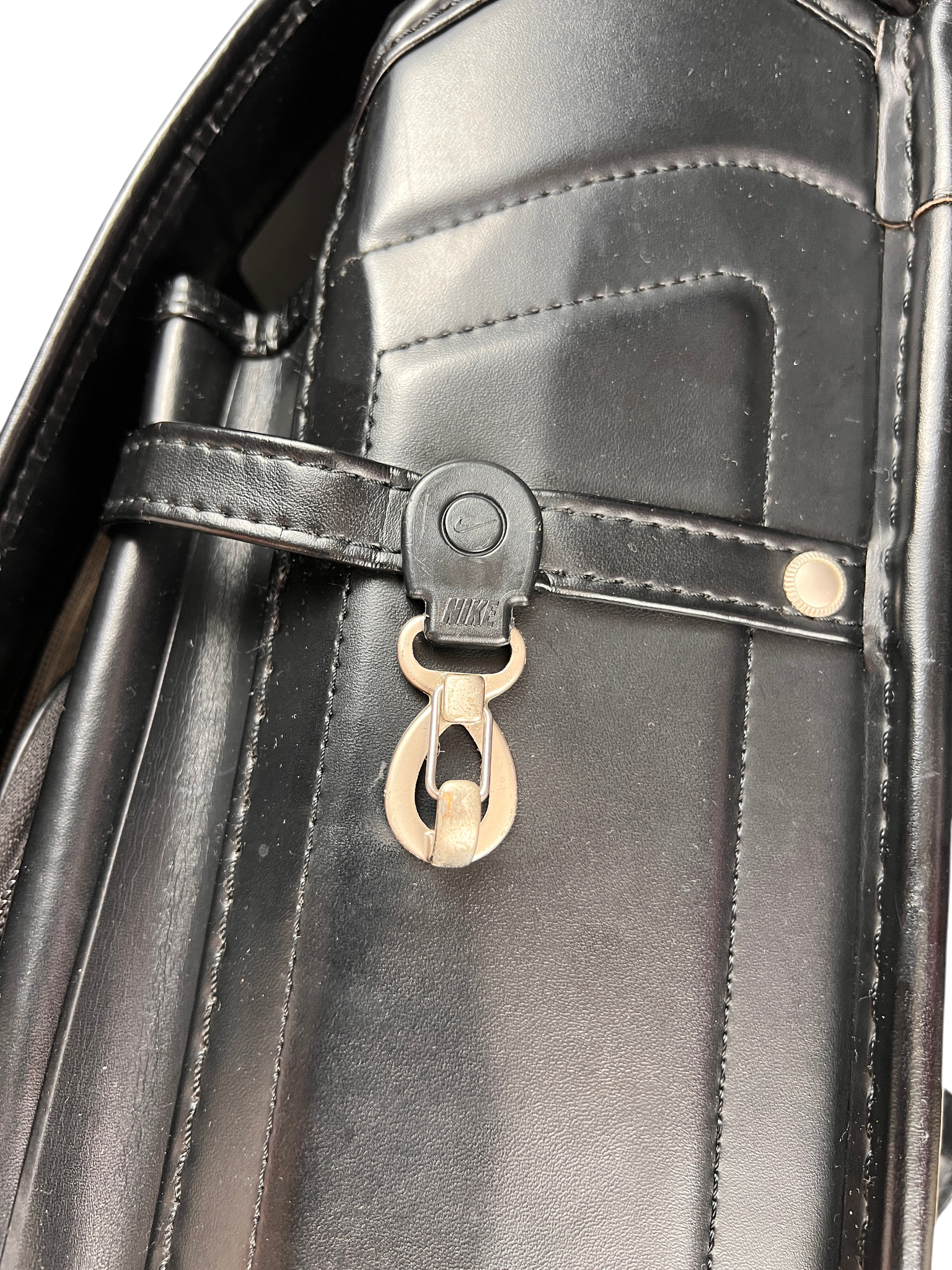 Nike Randoseru blackout - belt strap and turn-lock on the flap
