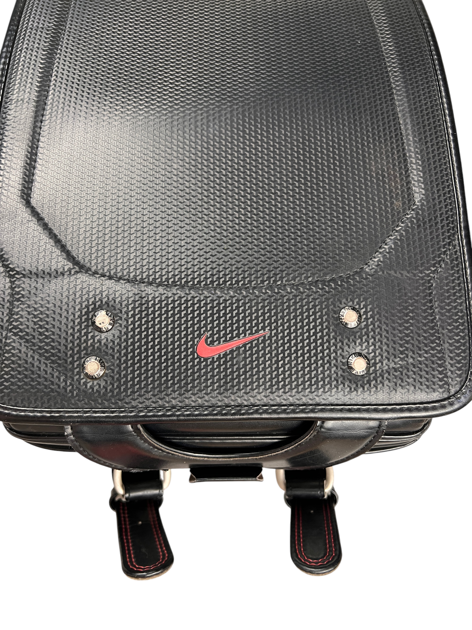 Nike Randoseru black and red - front flap close-up with rivets and red Swoosh