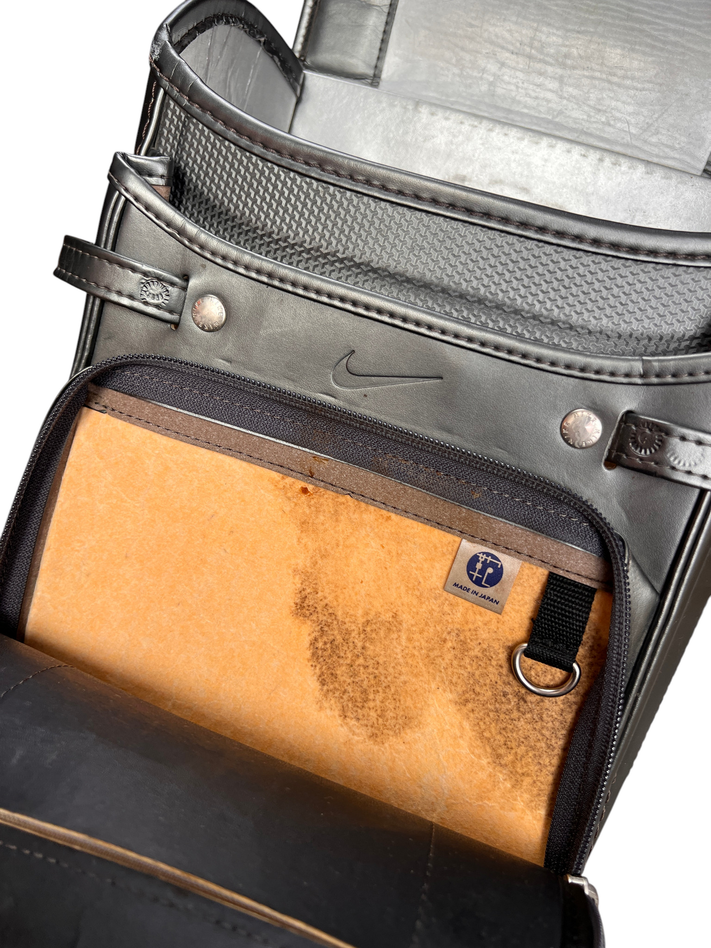 Nike Randoseru metallic charcoal and blue - inner pocket with tan panel and the Japan label
