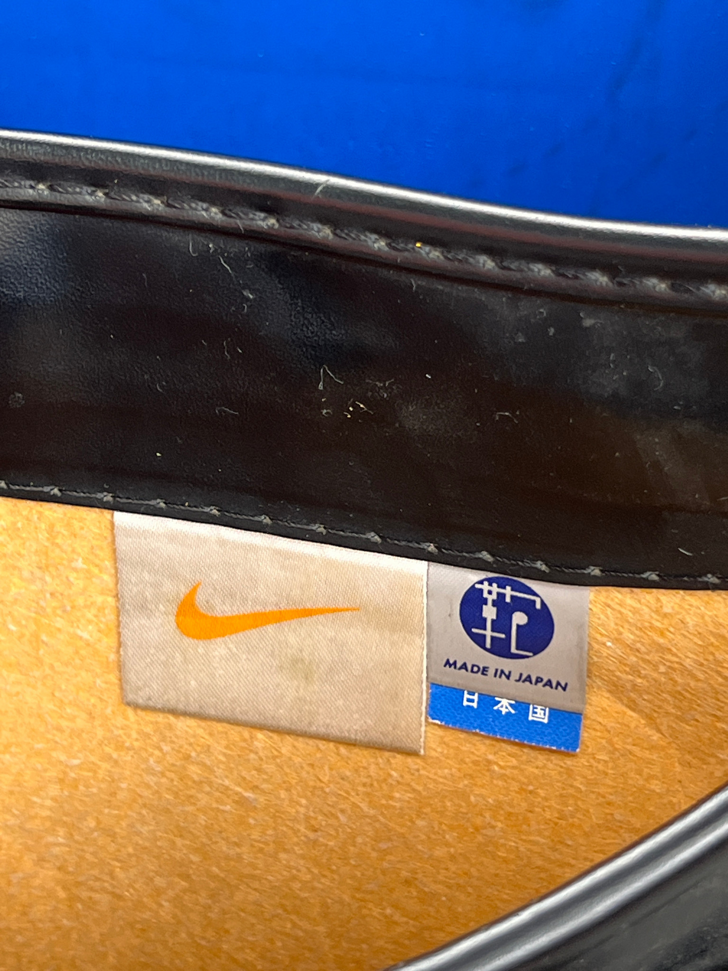 Nike Randoseru black and cream, blue Swoosh - Japan Bag Association label beside the Nike tag