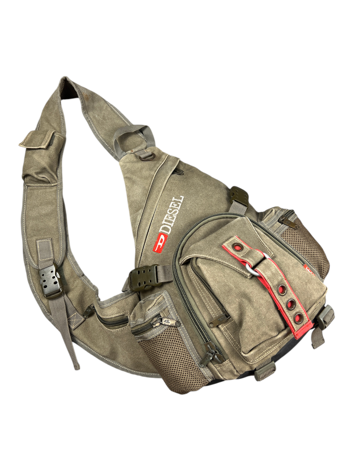 Y2K Diesel sling bag with padded shoulder harness laid flat