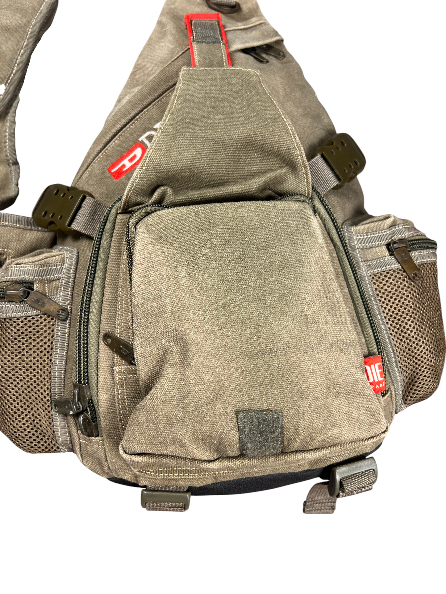 Front flap pocket with hook-and-loop closure on the Diesel sling bag
