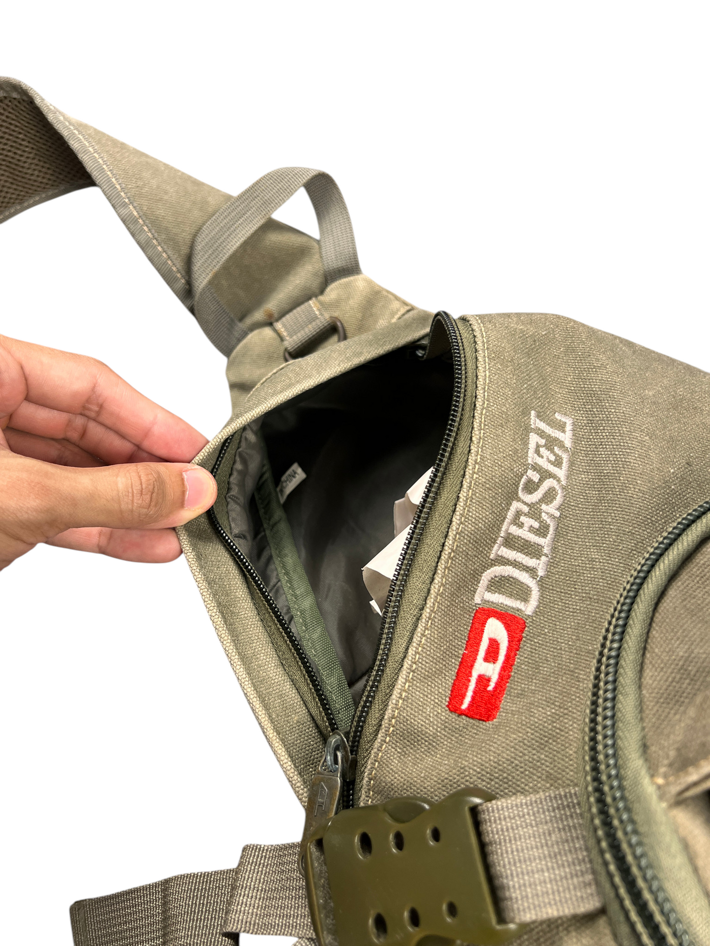Main zip compartment of the Diesel sling bag opened