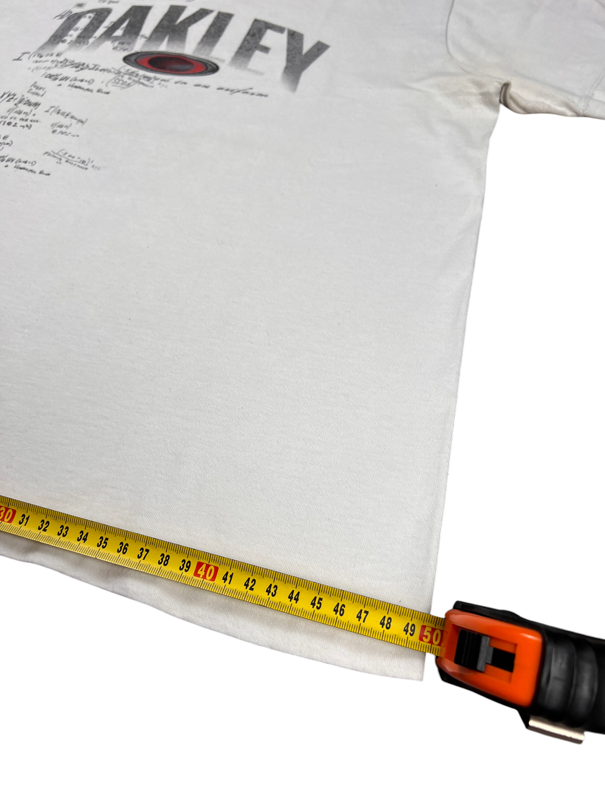 Hem width of the white Oakley Software t-shirt measured with a tape