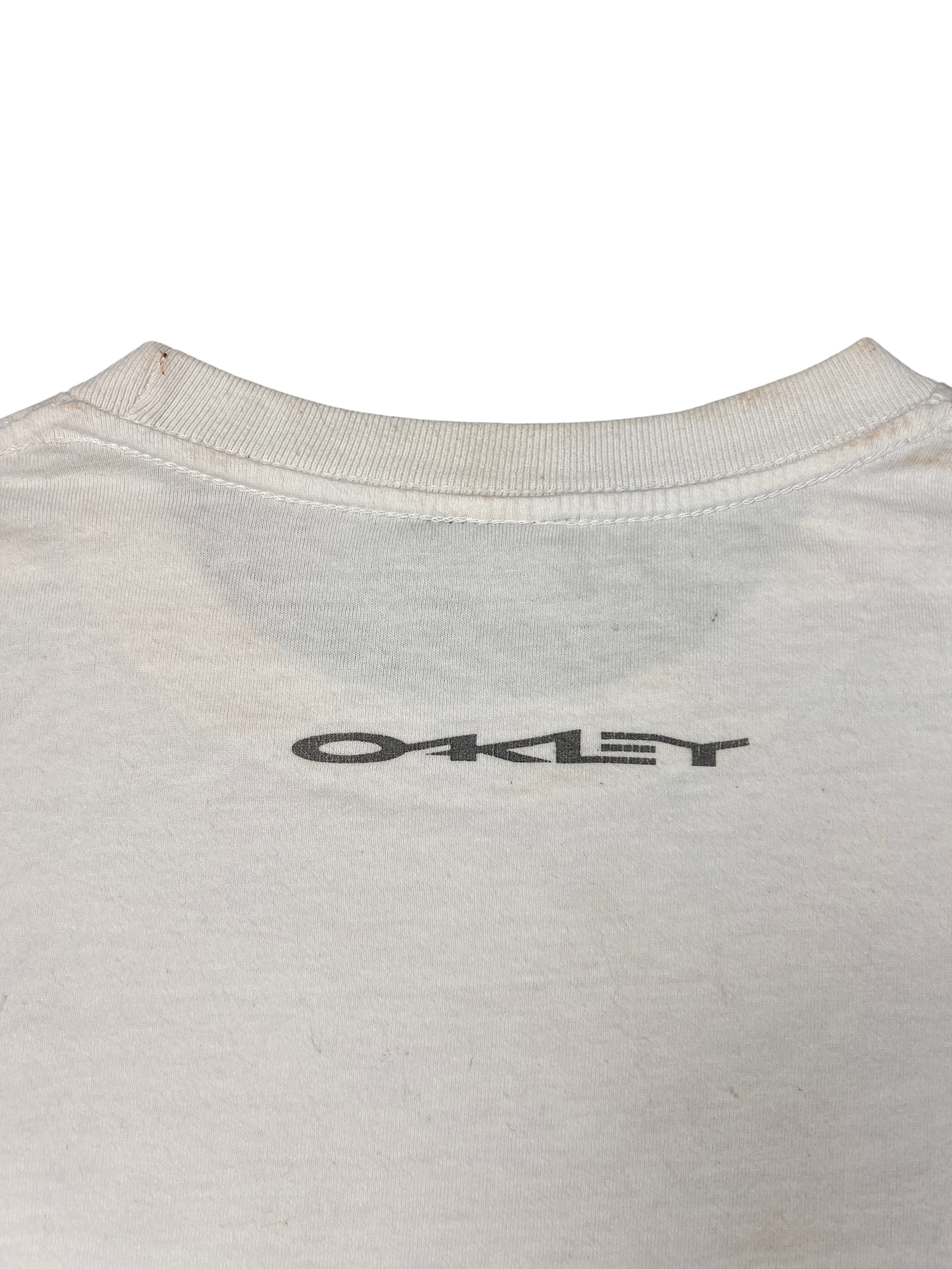 Small OAKLEY print below the back collar of the Software tee